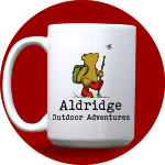 Glass coffee mug engraved with regal monogram of ivy, a shield, and a crown, above your name.