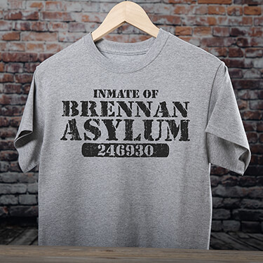 A231 Asylum - Inmate of Your Name Asylum, above an inmate number, on a grey T-shirt.