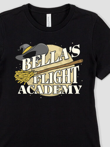 Your Name Flight Academy with a broom and witch's hat in front of a full moon on a short sleeve Bella Canvas ladies T shirt.
