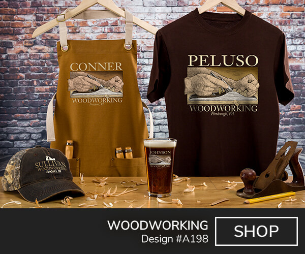 A198 | Woodworking - Your Name Woodworking, Your Location, around a rustic picture of a woodworker's hands as they plane a board of wood on a brown canvas work apron, dark chocolate tee, 2 tone camo baseball hat, and a color printed pint glass.