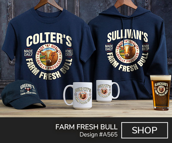 A565 | Farm Fresh Bull - Your Name, Farm Fresh Bull around a mock seal with a bull's head and grade A quality, locally produced, made daily, and knee deep on a navy blue tee, navy blue hooded sweatshirt, navy blue embroidered baseball hat, color printed coffee mugs, and a color printed pint glass.