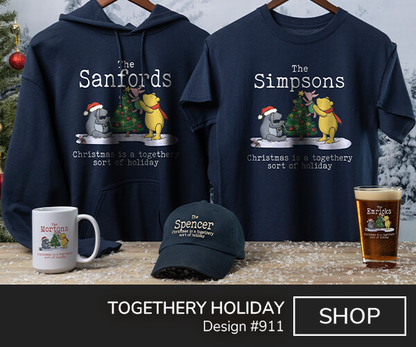 A911 | Togethery Holiday - Winnie the Pooh and Eeyore decorating a Christmas Tree, surrounded by Your Name, Christmas Is A Togethery Sort Of Holiday on a navy blue tee, navy hoodie, ceramic coffee mug, navy hat, and color printed pint glass.
