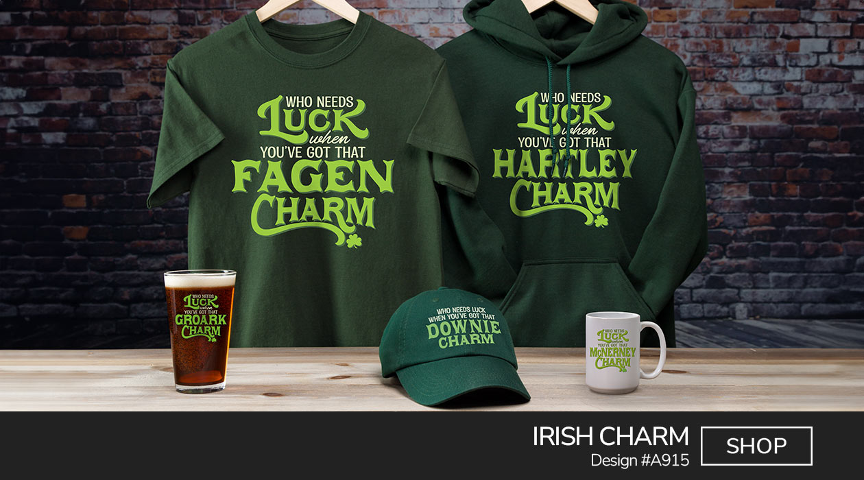 A915 | Irish Charm - Who Needs Luck When You've Got That Your Name Charm, punctuated with a little shamrock, on a forest green hoodie, T shirt, embroidered baseball hat, ceramic coffee mug, and color printed pint glass.