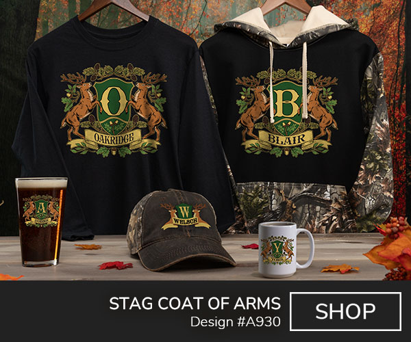 A930 | Stag Coat Of Arms - Two stags flank a shield with Your Monogram, above a banner with Your Name, surrounded by boughs of oak and pine, on a 2 tone camo hoodie, black long sleeve T shirt, color printed pint glass, 2 tone camo hat, and ceramic coffee mugs.