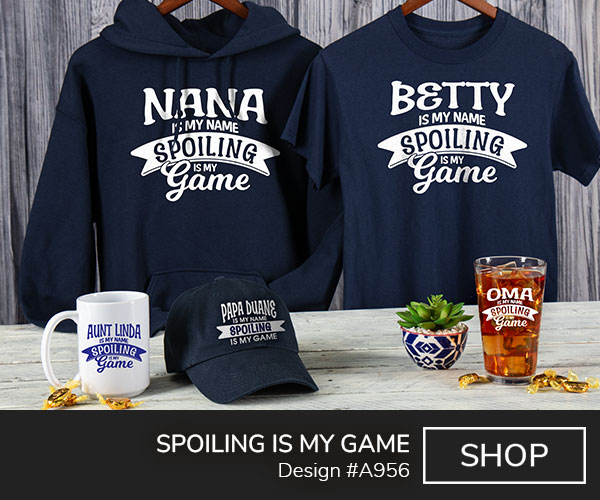 A956 | Spoiling Is My Game - Your Name Is My Name, Spoiling Is My Game on a navy hoodie, navy tee, navy baseball hat, ceramic mug, and a color printed pint glass.