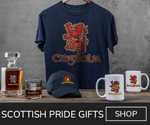 A variety of premium Scottish designs on a T shirt, ceramic coffee mugs, baseball hat, engraved decanter, and an engraved rocks glass.
